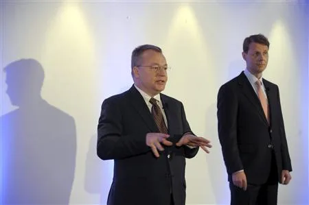 Nokia's CEO Elop gestures as Chairman Siilasmaa looks on, at a news conference prior to the Annual General Meeting of Nokia Corporation in Helsinki