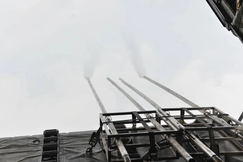 The salt and water mixture being released into the clouds.