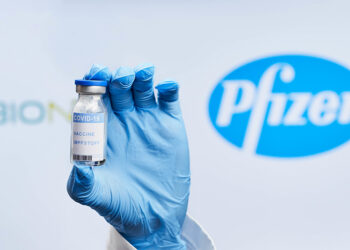 Doctor holding BioNTech and Pfizer Covid-19 vaccine
