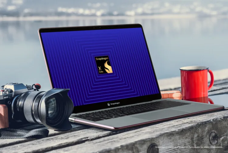 Foz Do Arelho, Portugal, February 27, 2020 - Laptop, Camera, Pad and phone on a bench at the seaside. Image on the laptop screen saying digital nomad.